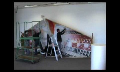 Dismantling of Cliff Whiting Māori Battalion art work at Archives New Zealand